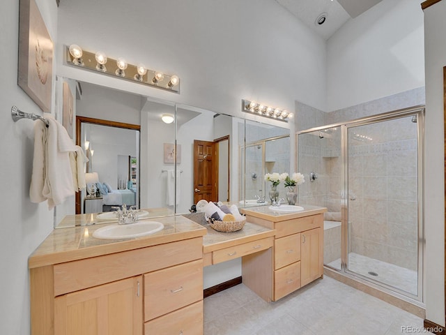 12658 W 1st Pl Unit 78, Denver, CO 80228 - ensuite bathroom with double vanity, a shower stall, and tile patterned flooring