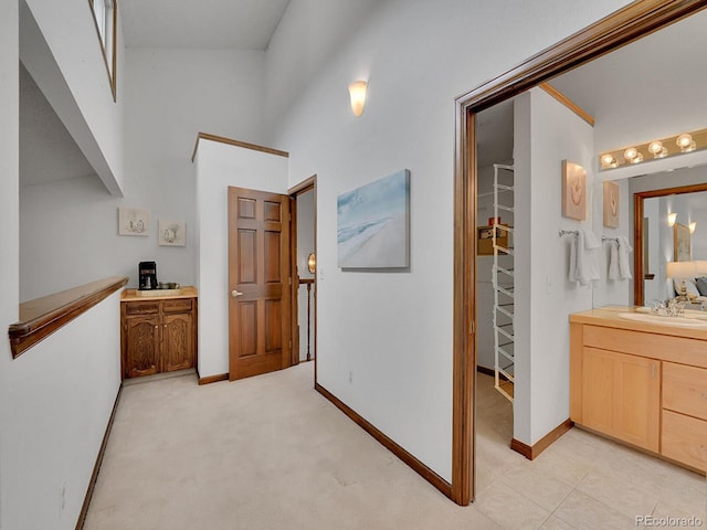 12658 W 1st Pl Unit 78, Denver, CO 80228 - hall featuring a sink and baseboards