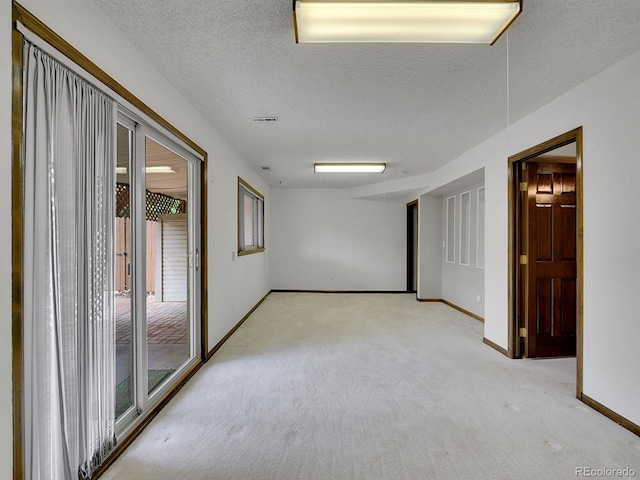 12658 W 1st Pl Unit 78, Denver, CO 80228 - unfurnished room featuring light carpet and a textured ceiling