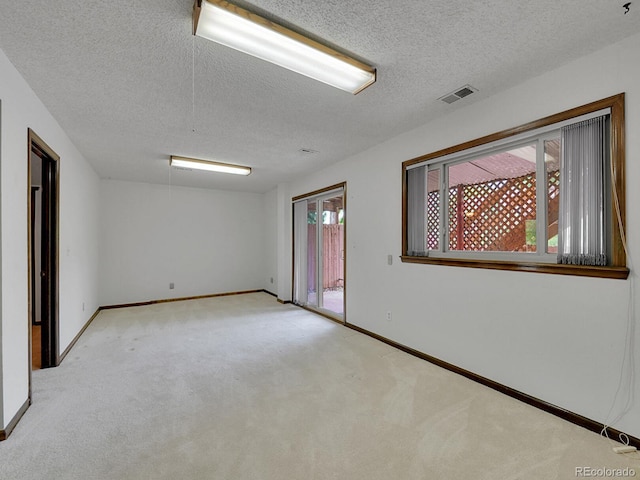 12658 W 1st Pl Unit 78, Denver, CO 80228 - carpeted spare room featuring a textured ceiling and baseboards