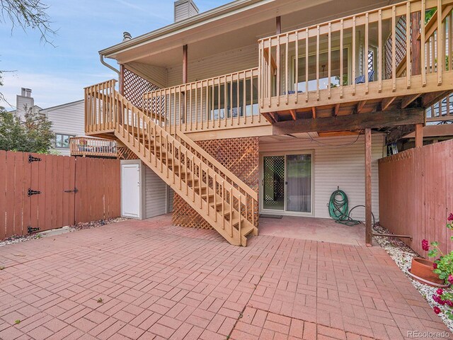 12658 W 1st Pl Unit 78, Denver, CO 80228 - view of patio featuring a gate, stairway, and a wooden deck