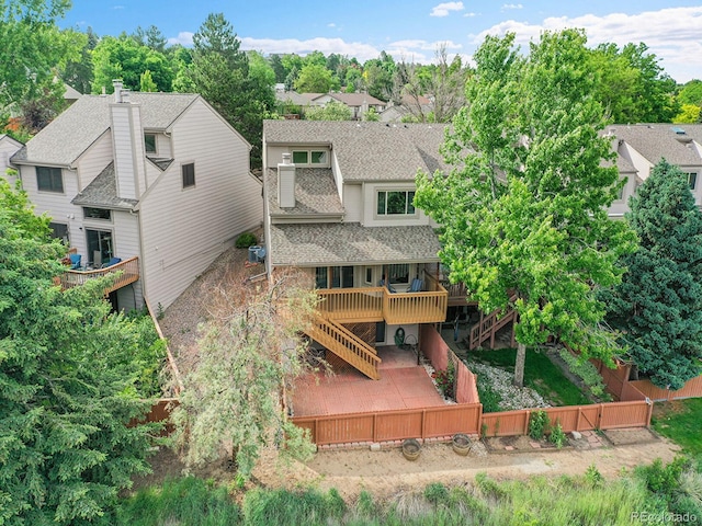 12658 W 1st Pl Unit 78, Denver, CO 80228 - rear view of house featuring a fenced backyard, stairway, a patio area, a deck, and a shingled roof