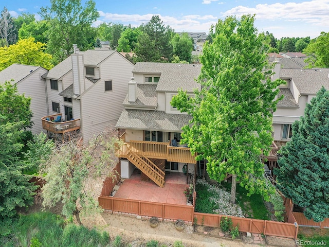 12658 W 1st Pl Unit 78, Denver, CO 80228 - rear view of house with a deck, stairs, a shingled roof, and a residential view