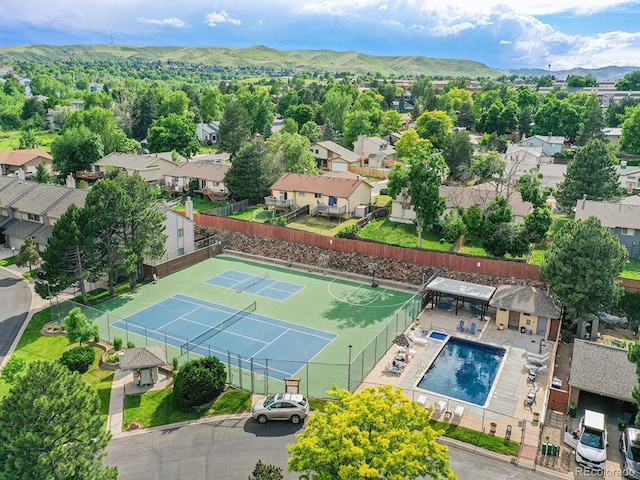 12658 W 1st Pl Unit 78, Denver, CO 80228 - aerial view of residential area featuring a pool area and a mountainous background