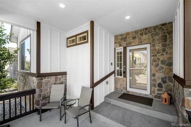 1210 Muskox St, Severance, CO 80550 - doorway to property featuring stone siding and board and batten siding