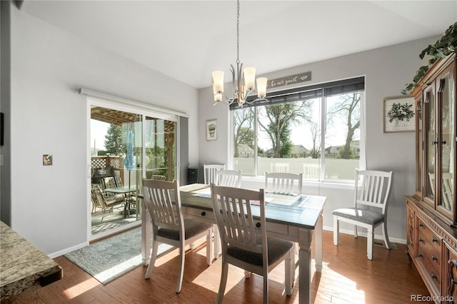 1210 Muskox St, Severance, CO 80550 - dining room with a chandelier and wood finished floors