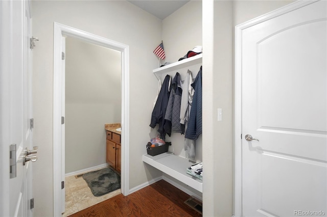 1210 Muskox St, Severance, CO 80550 - mudroom with wood finished floors and baseboards