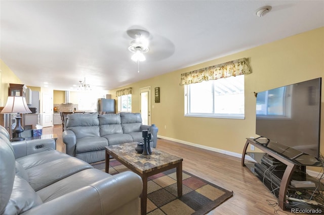 801 S 15th Ave, Brighton, CO 80601 - living room with light wood-style flooring, ceiling fan, and baseboards