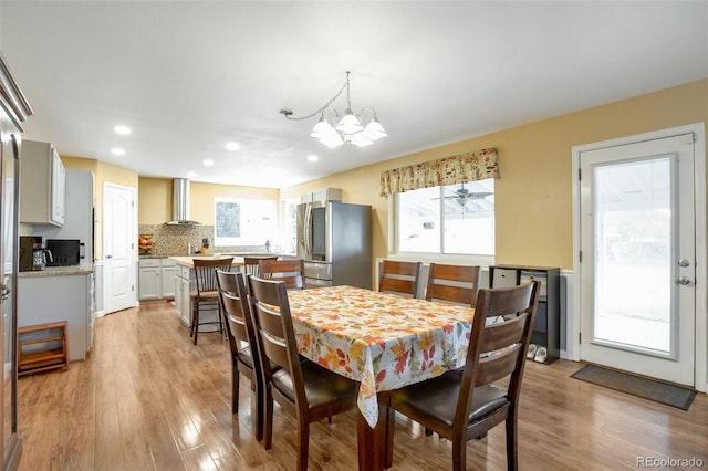 801 S 15th Ave, Brighton, CO 80601 - dining room with a chandelier, light wood finished floors, and recessed lighting