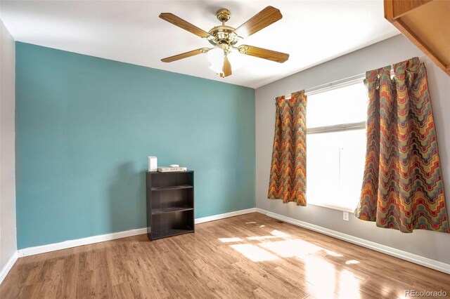 801 S 15th Ave, Brighton, CO 80601 - unfurnished room with wood finished floors, baseboards, and a ceiling fan
