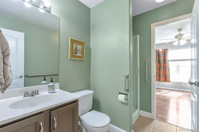 801 S 15th Ave, Brighton, CO 80601 - full bathroom with vanity, toilet, tile patterned flooring, a shower stall, and baseboards