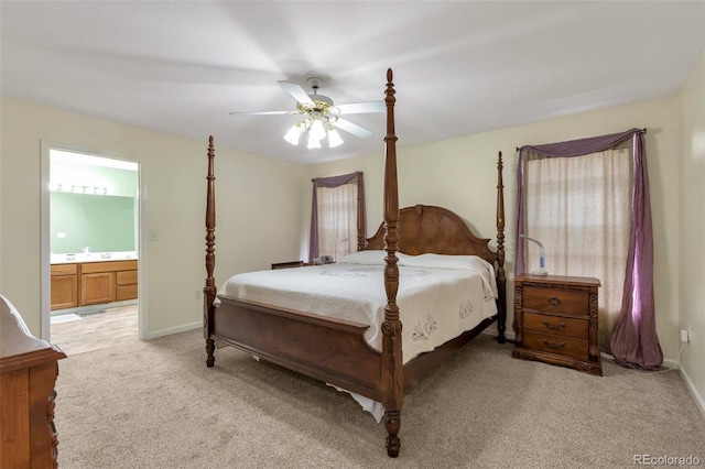 801 S 15th Ave, Brighton, CO 80601 - bedroom featuring light colored carpet, ensuite bathroom, ceiling fan, and baseboards
