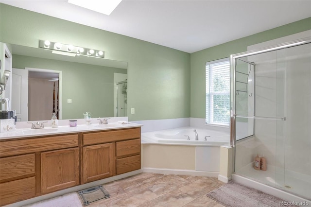 801 S 15th Ave, Brighton, CO 80601 - bathroom featuring double vanity, a shower stall, and a garden tub