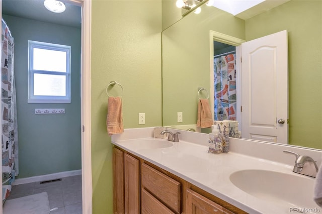 801 S 15th Ave, Brighton, CO 80601 - full bath featuring double vanity and tile patterned floors