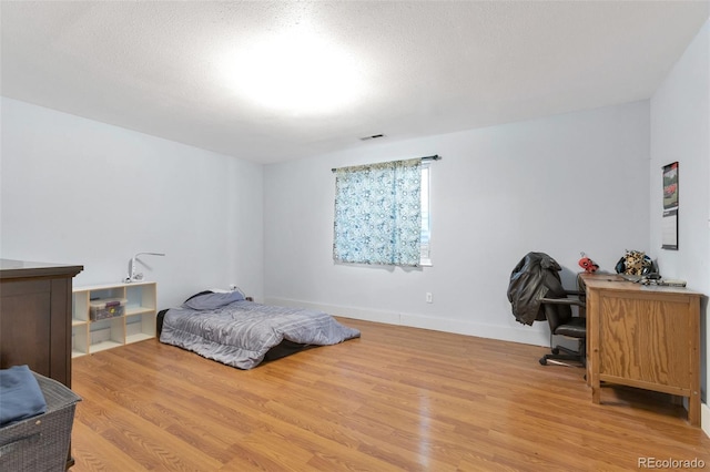 801 S 15th Ave, Brighton, CO 80601 - bedroom featuring light wood-type flooring and an office area