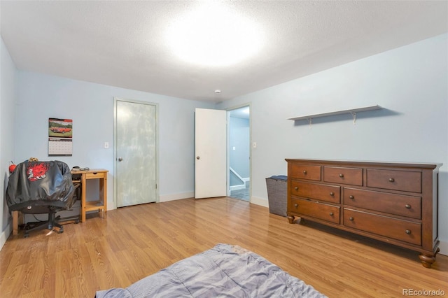 801 S 15th Ave, Brighton, CO 80601 - bedroom featuring light wood-type flooring and baseboards