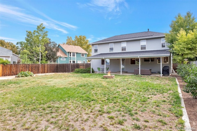 801 S 15th Ave, Brighton, CO 80601 - rear view of property featuring a patio area, an outdoor fire pit, and a hot tub