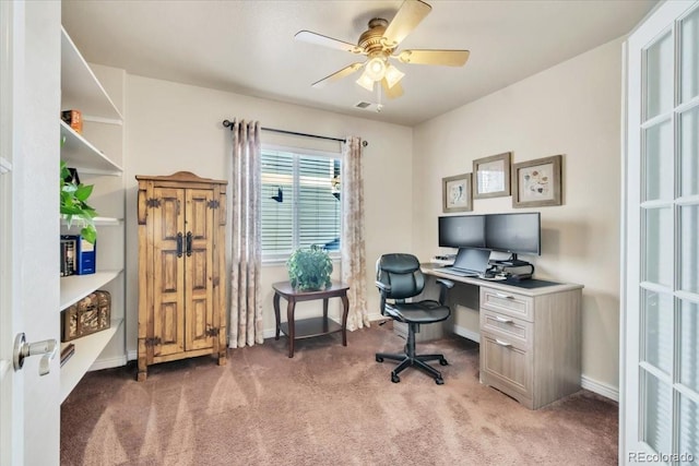 home office featuring ceiling fan and dark colored carpet