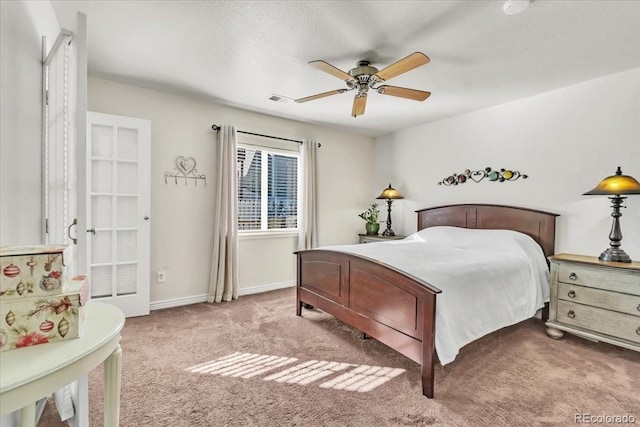 bedroom with ceiling fan and carpet flooring