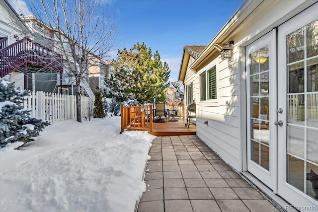 exterior space with a wooden deck and french doors