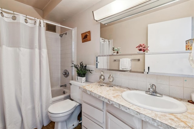 full bathroom with tasteful backsplash, vanity, toilet, and shower / bath combo