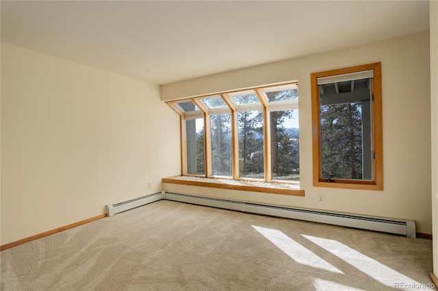 unfurnished room featuring carpet and a baseboard heating unit