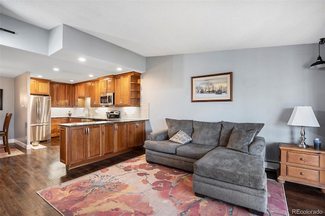 living room with dark hardwood / wood-style flooring and baseboard heating