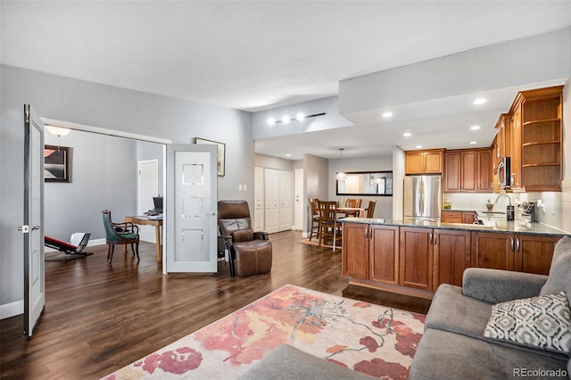 living room with dark hardwood / wood-style floors and french doors