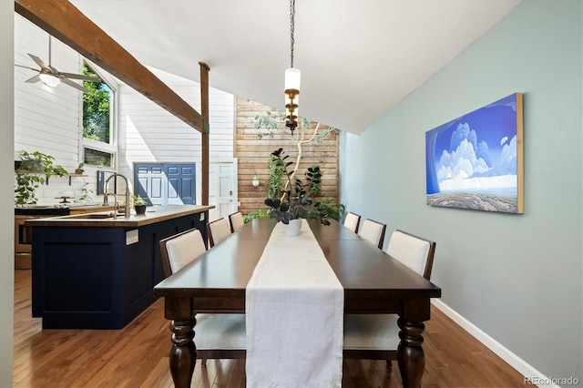 6305 W 6th Ave Unit C12, Lakewood, CO 80214 - dining space with vaulted ceiling, wood finished floors, and ceiling fan