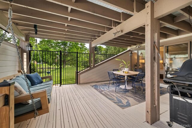 6305 W 6th Ave Unit C12, Lakewood, CO 80214 - wooden deck with outdoor dining space, area for grilling, and an outdoor hangout area