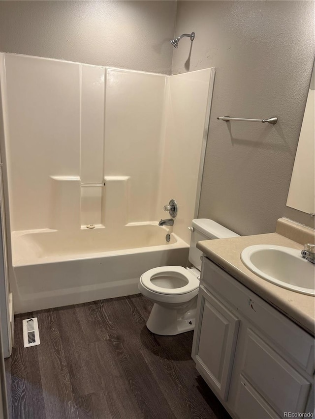 1222 Yosemite St, Denver, CO 80220 - full bath with wood finished floors, vanity, and shower / bath combination