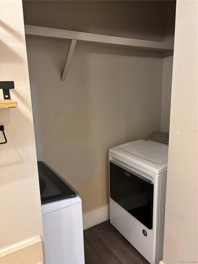 1222 Yosemite St, Denver, CO 80220 - laundry room with dark wood-style flooring and washing machine and clothes dryer