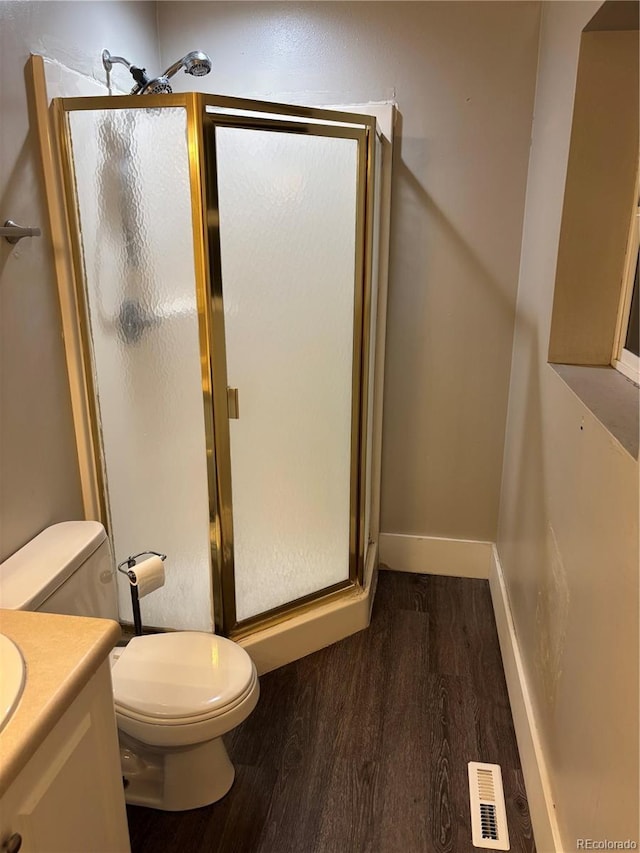 1222 Yosemite St, Denver, CO 80220 - full bath with wood finished floors, vanity, and a shower stall