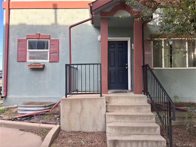 1222 Yosemite St, Denver, CO 80220 - doorway to property featuring stucco siding