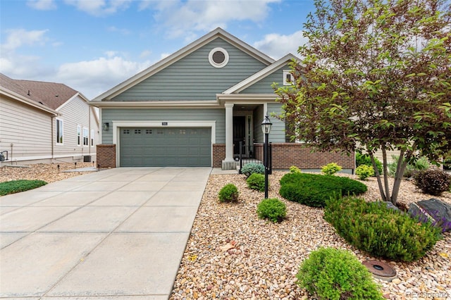 7991 Heritage Dr, Thornton, CO 80602 - view of front of house with brick siding, concrete driveway, and an attached garage