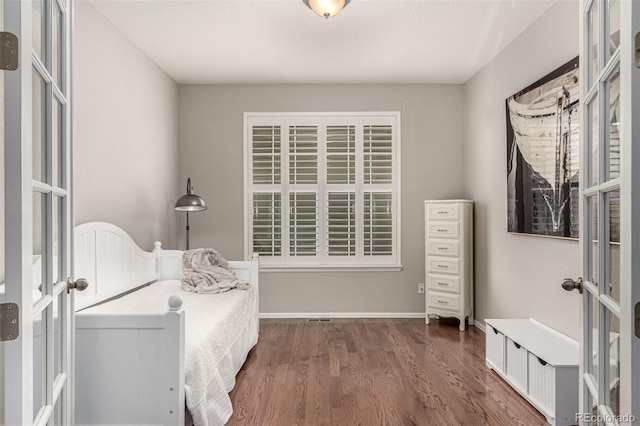 7991 Heritage Dr, Thornton, CO 80602 - bedroom featuring dark wood-style flooring and baseboards