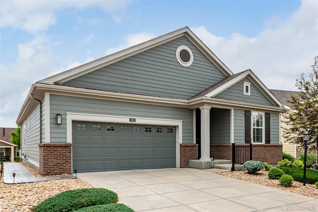 7991 Heritage Dr, Thornton, CO 80602 - view of front of house with brick siding, driveway, a porch, and a garage