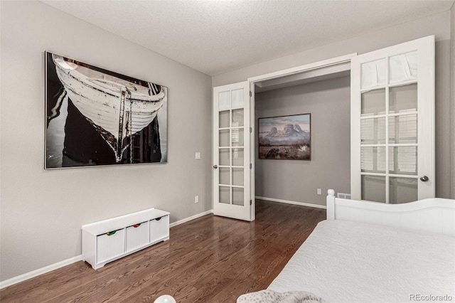 7991 Heritage Dr, Thornton, CO 80602 - bedroom with wood finished floors, baseboards, and french doors