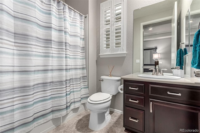 7991 Heritage Dr, Thornton, CO 80602 - bathroom featuring toilet, vanity, a textured wall, a shower with curtain, and tile patterned flooring