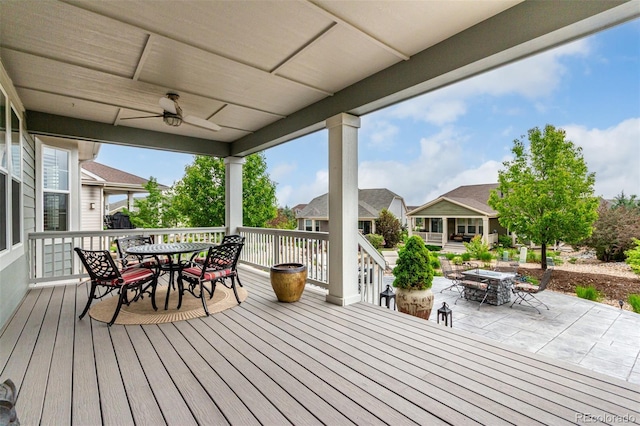 7991 Heritage Dr, Thornton, CO 80602 - wooden deck featuring outdoor dining space, ceiling fan, a patio, and a residential view