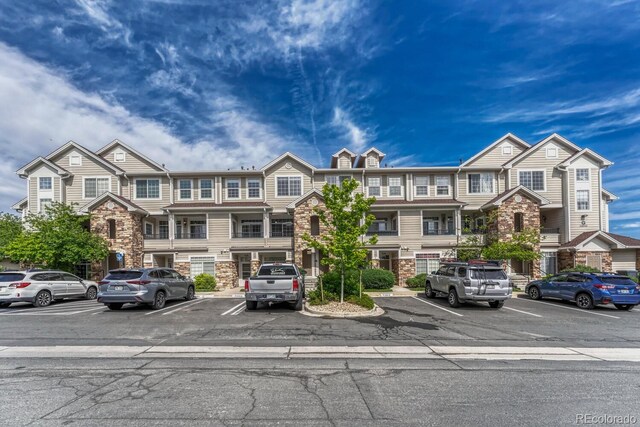 12711 Colorado Blvd Unit 714G, Thornton, CO 80241 - multi unit property featuring stone siding and uncovered parking