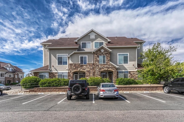 12711 Colorado Blvd Unit 714G, Thornton, CO 80241 - view of front of home with stone siding and uncovered parking
