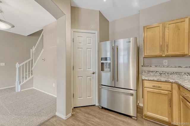 12711 Colorado Blvd Unit 714G, Thornton, CO 80241 - kitchen with high end fridge, light brown cabinets, light wood finished floors, light stone countertops, and baseboards