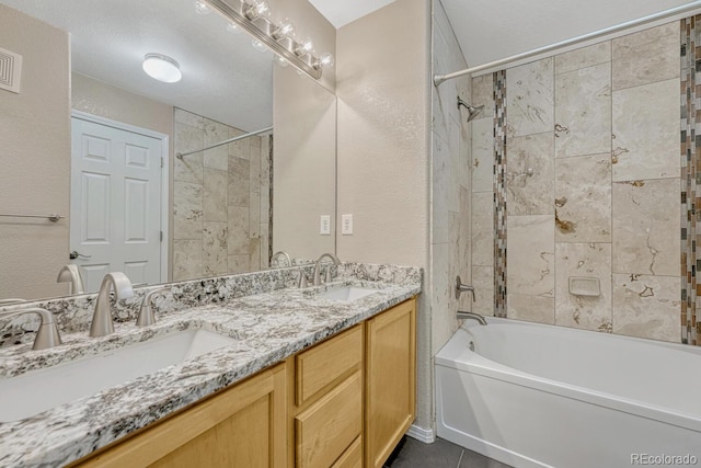 12711 Colorado Blvd Unit 714G, Thornton, CO 80241 - full bathroom with shower / washtub combination, double vanity, tile patterned flooring, and a textured wall