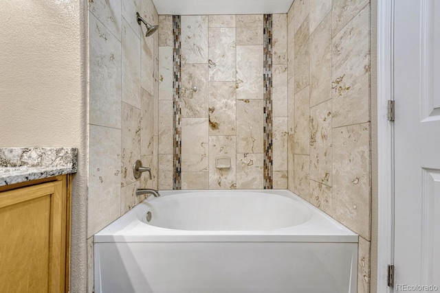 12711 Colorado Blvd Unit 714G, Thornton, CO 80241 - full bathroom featuring vanity, a textured wall, and shower / bath combination