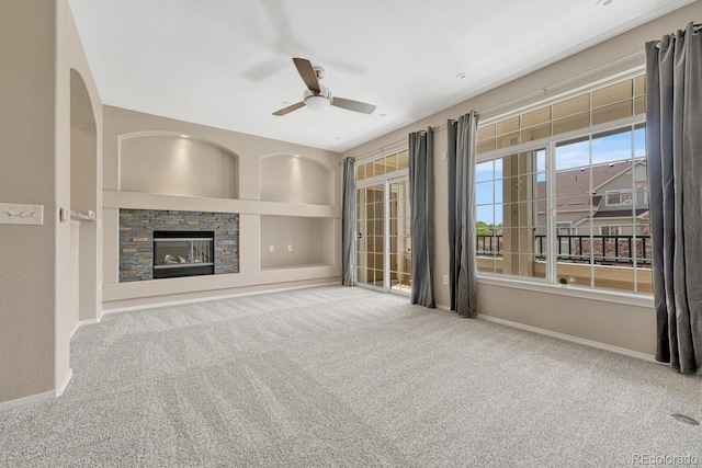 12711 Colorado Blvd Unit 714G, Thornton, CO 80241 - unfurnished living room featuring ceiling fan, carpet floors, a fireplace, and baseboards