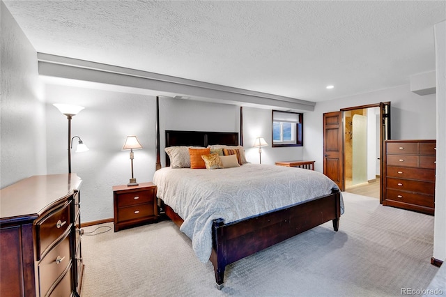 bedroom featuring baseboards, recessed lighting, a textured ceiling, and light colored carpet