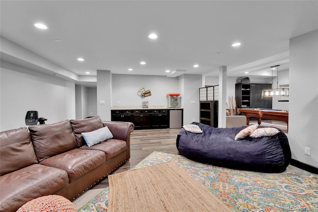 living area featuring pool table, bar area, recessed lighting, and light wood-style flooring