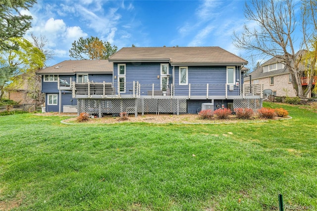 back of property with a yard, central AC, and a deck