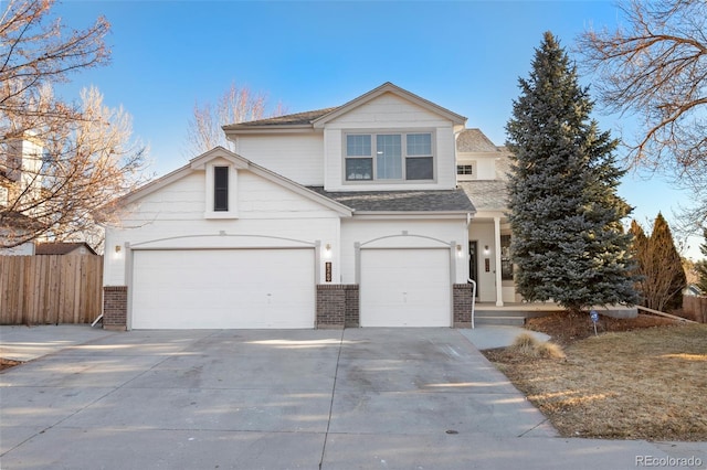 8369 W Fairview Ave, Littleton, CO 80128 - traditional-style home with roof with shingles, driveway, fence, brick siding, and a garage